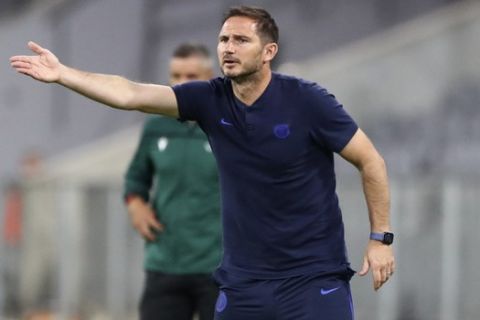 Chelsea's head coach Frank Lampard gestures during the Champions League round of 16 second leg soccer match between Bayern Munich and Chelsea at Allianz Arena in Munich, Germany, Saturday, Aug. 8, 2020. (AP Photo/Matthias Schrader)