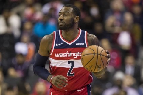 Washington Wizards guard John Wall (2) dribbles the ball during the second half of an NBA basketball game Cleveland Cavaliers, Wednesday, Nov. 14, 2018, in Washington. The Wizards won 119-95. (AP Photo/Alex Brandon)