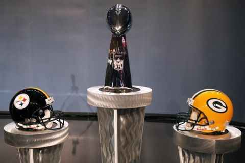 DALLAS, TX - FEBRUARY 04:  The Vince Lombardi Trophy is displayed between a Pittsburgh Steelers helmet and a Green Bay Packers helmet during a press conference with NFL commissioner Roger Goodell at the Super Bowl XLV media center on February 4, 2011 in Dallas, Texas. The Green Bay Packers will play the Pittsburgh Steelers in Super Bowl XLV on February 6, 2011 at Cowboys Stadium in Arlington, Texas.  (Photo by Doug Pensinger/Getty Images)