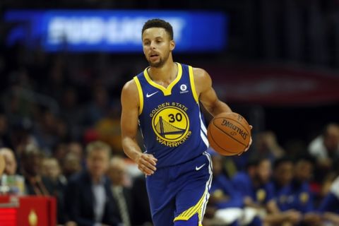 Golden State Warriors guard Stephen Curry dribbles during the second half of an NBA basketball game against the Los Angeles Clippers, Monday, Oct. 30, 2017, in Los Angeles. (AP Photo/Ryan Kang)