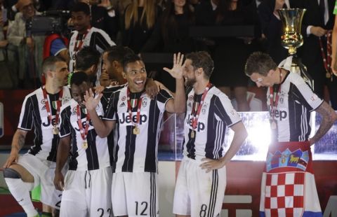 Juventus' Alex Sandro and teammates celebrate after winning the Italian Cup soccer final match between Lazio and Juventus, at Rome's Olympic stadium, Wednesday, May 17, 2017. Juventus won 2-0. (AP Photo/Gregorio Borgia)