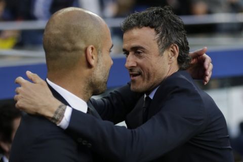 Barcelonas head coach Luis Enrique, right, welcomes Bayern's head coach Pep Guardiola prior to the Champions League semifinal first leg soccer match between Barcelona and Bayern Munich at the Camp Nou stadium in Barcelona, Spain, Wednesday, May 6, 2015.  (AP Photo/Manu Fernandez)