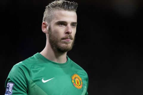 TO GO WITH STORY BY TOM WILLIAMS  (FILES) In a file picture taken on March 9, 2015 Manchester United's Spanish goalkeeper David de Gea looks on during the FA Cup quarter-final football match between Manchester United and Arsenal at Old Trafford in Manchester, north west England. After returning to the Premier League's top four, Manchester United have once again recruited widely, but there are concerns about the balance of their squad ahead of the new season. The club's Player of the Season in 2014-15, De Gea is set to start the new campaign between the sticks, but Argentina's Sergio Romero has been drafted in to provide back-up, further marginalising Victor Valdes.  AFP PHOTO / OLI SCARFF     RESTRICTED TO EDITORIAL USE. No use with unauthorized audio, video, data, fixture lists, club/league logos or live services. Online in-match use limited to 45 images, no video emulation. No use in betting, games or single club/league/player publications.