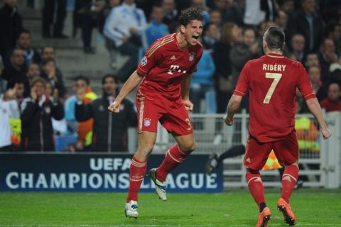 Bayern Munich's striker Mario Gomez (L) celebrates after scoring a goal during the UEFA Champions League quarter final football match Marseille vs. Bayern Munich on March 28, 2012 at the V drome stadium in Marseille.  AFP PHOTO / ANNE-CHRISTINE POUJOULAT (Photo credit should read ANNE-CHRISTINE POUJOULAT/AFP/Getty Images)
