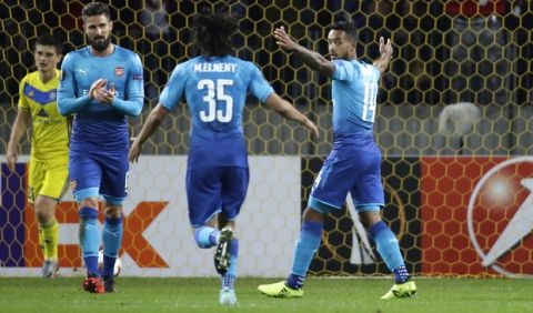 Arsenal's Theo Walcott, right, celebrates after scoring his side's second goal during the Europa League group H soccer match between Bate and Arsenal at the Borisov-Arena stadium in Borisov, Belarus, Thursday, Sept. 28, 2017. (AP Photo/Sergei Grits)