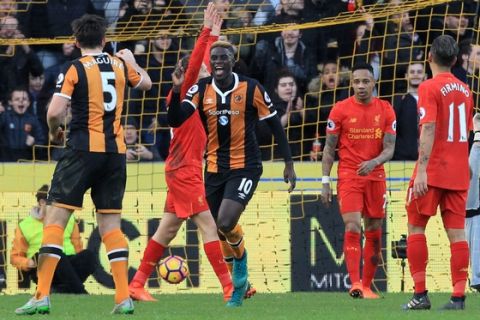 Hull City's French midfielder Alfred N'Diaye (C) celebrates after scoring the opening goal of the English Premier League football match between Hull City and Liverpool at the KCOM Stadium in Kingston upon Hull, north east England on February 4, 2017. / AFP / Lindsey PARNABY / RESTRICTED TO EDITORIAL USE. No use with unauthorized audio, video, data, fixture lists, club/league logos or 'live' services. Online in-match use limited to 75 images, no video emulation. No use in betting, games or single club/league/player publications.  /         (Photo credit should read LINDSEY PARNABY/AFP/Getty Images)