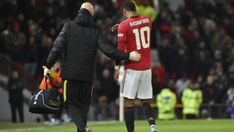 Manchester United's substitute player Marcus Rashford walks off the pitch with an injury during the English FA Cup third round replay soccer match between Manchester United and Wolverhampton Wanderers at Old Trafford in Manchester, England, Wednesday, Jan. 15, 2020. (AP Photo/Rui Vieira)