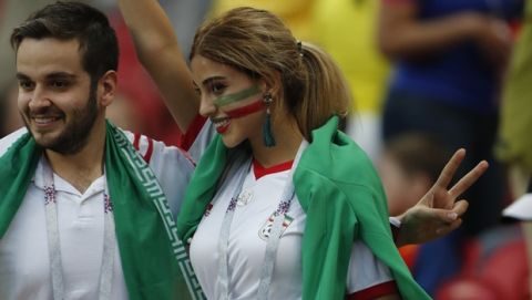Iranian soccer fans cheer as they wait for the group B match between Iran and Spain at the 2018 soccer World Cup in the Kazan Arena in Kazan, Russia, Wednesday, June 20, 2018. (AP Photo/Frank Augstein)