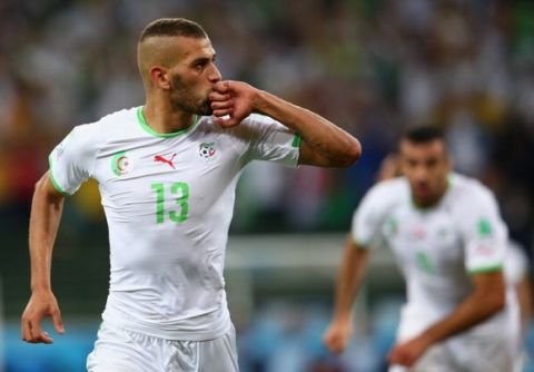 CURITIBA, BRAZIL - JUNE 26:  Islam Slimani of Algeria celebrates scoring his team's first goal during the 2014 FIFA World Cup Brazil Group H match between Algeria and Russia at Arena da Baixada on June 26, 2014 in Curitiba, Brazil.  (Photo by Julian Finney/Getty Images)
