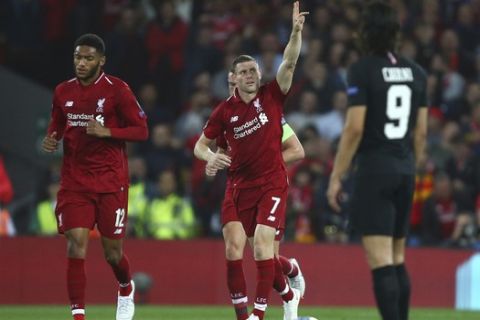 Liverpool's James Milner, centre, celebrates after he scores his sides second goal during the Champions League Group C soccer match between Liverpool and Paris-Saint-Germain at Anfield stadium in Liverpool, England, Tuesday, Sept. 18, 2018. (AP Photo/Dave Thompson)