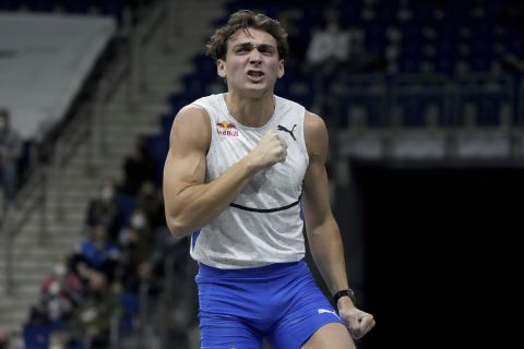 Sweden's Armand Duplantis celebrates after crossing 6.03 meter during the men's pole vault competition as part of the 2022 Indor ISTAF track and field meeting in Berlin, Germany, Friday, Feb. 4, 2022. (AP Photo/Michael Sohn)