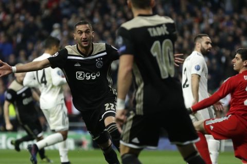 Ajax's Hakim Ziyech celebrates scoring the opening goal during the Champions League soccer match between Real Madrid and Ajax at the Santiago Bernabeu stadium in Madrid, Spain, Tuesday, March 5, 2019. (AP Photo/Manu Fernandez)