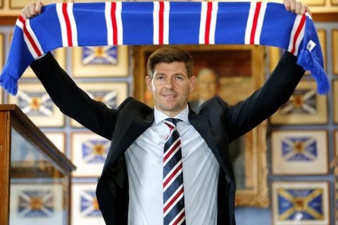 Rangers new manager Steven Gerrard is presented during a press conference at Ibrox Stadium, Glasgow, Scotland, Friday, May 4, 2018. Liverpool great Steven Gerrard was appointed coach of Scottish club Rangers on Friday, tasked with closing the gap on Glasgow rival Celtic. (Jeff Holmes/PA via AP)