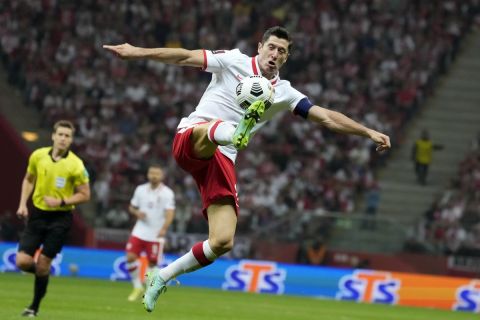 FILE - Poland's Robert Lewandowski controls the ball during the World Cup 2022 group I qualifying soccer match between Poland and England, at the Narodowy stadium in Warsaw, Wednesday, Sept. 8, 2021. Poland captain Robert Lewandowski will shoulder his countrys World Cup hopes as the star name in coach Czesaw Michniewicz 26-player squad for the tournament in Qatar. Michniewicz, formerly coach of Polands under-21s then Legia Warsaw, named his team on Thursday, Nov. 10, 2022. (AP Photo/Czarek Sokolowski, File)