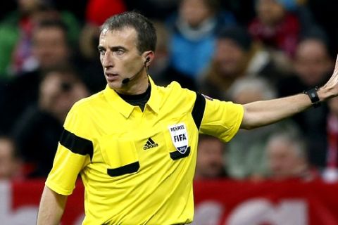 Referee Fernandez Borbalan gestures during the Champions League group D soccer match between FC Bayern Munich and Manchester City, in Munich, southern Germany, Tuesday, Dec. 10, 2013. (AP Photo/Matthias Schrader)