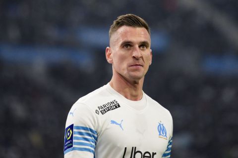 Marseille's Arkadiusz Milik looks up during a French League One soccer match between Marseille and Reims at the Velodrome stadium in Marseille, France, Wednesday, Dec. 22, 2021. (AP Photo/Daniel Cole)