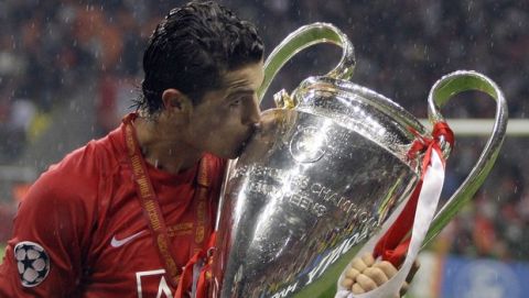** FILE ** In this May 21, 2008 file photo, Manchester United's Cristiano Ronaldo kisses the trophy at the end of the Champions League final soccer match at the Luzhniki Stadium in Moscow United could put Ronaldo up for sale in what would almost certainly be a world record transfer fee of about $119 million.  (AP Photo/Sergey Ponomarev, File)