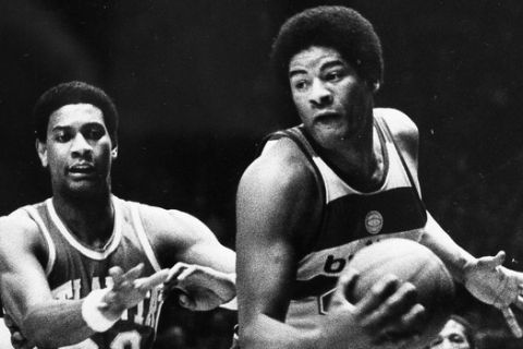 Wes Unseld of the Washington Bullets takes in an offensive rebound against John Drew (22) of the Atlanta Hawks during second period action at the Capital Centre in Landover, Md., Jan. 30, 1979.  (AP Photo)