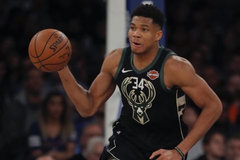 Milwaukee Bucks forward Giannis Antetokounmpo (34) brings the ball down court during the second half of an NBA basketball game against the New York Knicks, Saturday, Dec. 1, 2018, in New York.(AP Photo/Julie Jacobson)