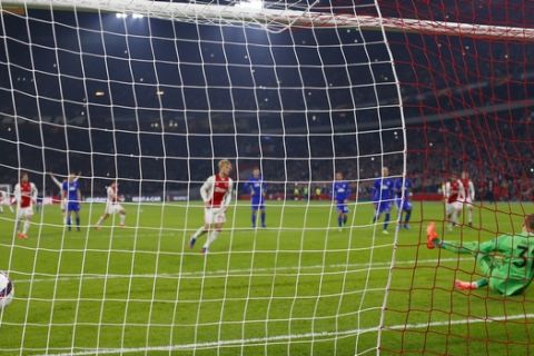 Kobenhavn's goalkeeper Robin Olsen dives to the wrong corner as Ajax's Kasper Dolberg scores 2-0 with a penalty during Europa League round of 16, second leg, soccer match between Ajax and Kobenhavn at the Amsterdam ArenA stadium in Amsterdam, Netherlands, Thursday, March 16, 2017. (AP Photo/Peter Dejong)