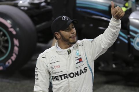 Mercedes driver Lewis Hamilton of Britain gives thumb up after the qualifying session at the Yas Marina racetrack in Abu Dhabi, United Arab Emirates, Saturday Nov. 24, 2018. The Emirates Formula One Grand Prix will take place on Sunday. (AP Photo/Kamran Jebreili)