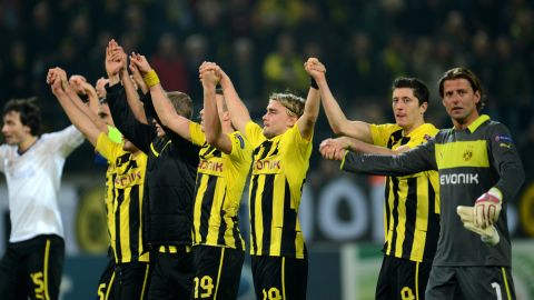 Dortmund´s players celebrate after during the UEFA Champions League Group D football match BVB Borussia Dortmund vs Real Madrid in Dortmund, western Germany on October 24, 2012. Dortmund won the match 2-1. AFP PHOTO / PATRIK STOLLARZ        (Photo credit should read PATRIK STOLLARZ/AFP/Getty Images)