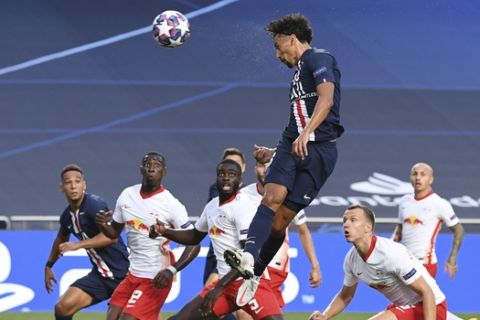 PSG's Marquinhos scores his side's first goal during the Champions League semifinal soccer match between RB Leipzig and Paris Saint-Germain at the Luz stadium in Lisbon, Portugal, Tuesday, Aug. 18, 2020. (David Ramos/Pool Photo via AP)