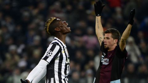 Juventus' French midfielder Paul Labile Pogba (L) reacts after missing a shot during the UEFA Champions League group B football match Juventus vs Copenhagen, on November 26, 2013 at the Juventus stadium in Turin. AFP PHOTO / OLIVIER MORIN        (Photo credit should read OLIVIER MORIN/AFP/Getty Images)