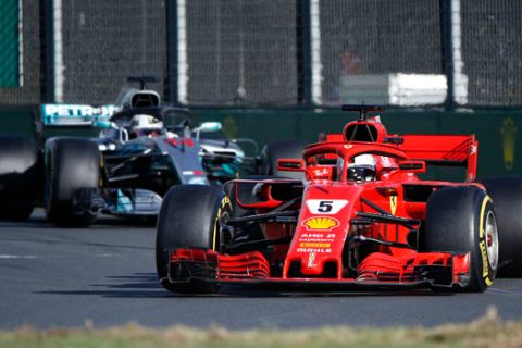 Ferrari driver Sebastian Vettel of Germany steers his car ahead of Mercedes driver Lewis Hamilton of Britain during the Australian Formula One Grand Prix in Melbourne, Australia, Sunday, March 25, 2018. (AP Photo/Asanka Brendon Ratnayake)