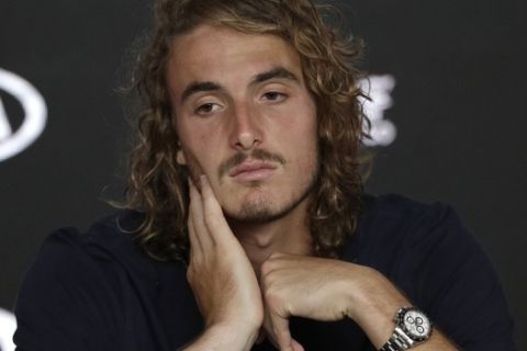 Greece's Stefanos Tsitsipas answers questions at press conference following his semifinal loss to Spain's Rafael Nadal at the Australian Open tennis championships in Melbourne, Australia, Thursday, Jan. 24, 2019. (AP Photo/Aaron Favila)