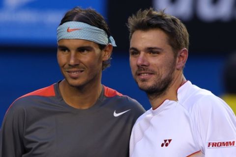 Rafael Nadal of Spain, left,  and Stanislas Wawrinka of Switzerland pose for a photo at the net before their men's singles final at the Australian Open tennis championship in Melbourne, Australia, Sunday, Jan. 26, 2014.(AP Photo/Aaron Favila)