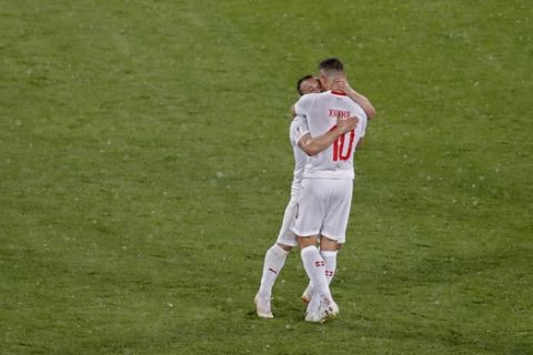 Switzerland's Xherdan Shaqiri and Granit Xhaka, right, celebrate at the end of the group E match between Switzerland and Serbia at the 2018 soccer World Cup in the Kaliningrad Stadium in Kaliningrad, Russia, Friday, June 22, 2018. Shaqiri and Xhaka scored once each in Switzerland's 2-1 victory. (AP Photo/Antonio Calanni)