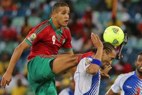 Morocco's Youssef El Arabi, left, leaps for the ball against Cape Verde "Nando" Neves, center,  during the  Africa Cup of Nations game at the Moses Mabhida Stadium in Durban, South Africa, Wednesday, Jan. 23, 2013. (AP Photo/Schalk van Zuydam)