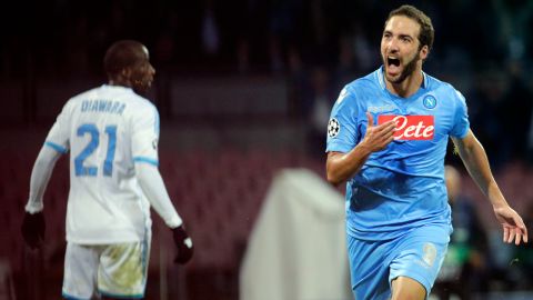 Napoli's Argentinian forward Gonzalo Higuain celebrates after scoring a goal during an UEFA Champions League group F football match between SSC Napoli and Olympique de Marseille at the San Paolo Stadium in Naples on November 6, 2013..    AFP PHOTO/CARLO HERMANN        (Photo credit should read CARLO HERMANN/AFP/Getty Images)
