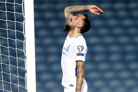 Greece's Kostas Mitroglou gestures during the World Cup Group H qualifying soccer match between Gibraltar and Greece outside Faro, southern Portugal, Tuesday, Sept. 6, 2016. (AP Photo/Armando Franca)