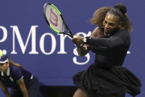 Serena Williams returns a shot to Venus Williams in the third round of the U.S. Open tennis tournament at the USTA Billie Jean King National Tennis Center on Friday, Aug. 31, 2018, in New York. (Photo by Greg Allen/Invision/AP)
