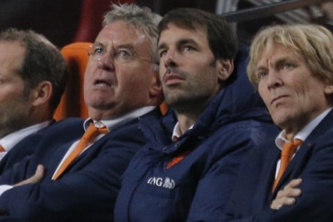 Netherlands head coach Guus Hiddink, second left, and assistant coach Ruud van Nistelrooy, second right, watch a replay of the sixth goal during the Euro 2016 group A qualifying round soccer match between the Netherlands and Latvia at ArenA stadium in Amsterdam, Netherlands, Sunday, Nov. 16, 2014. Netherlands won the match with a 6-0 score. (AP Photo/Peter Dejong)
