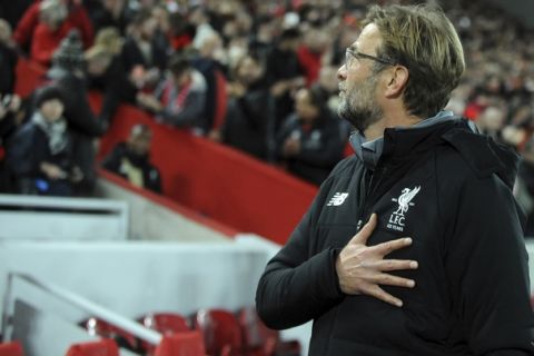 Liverpool manager Juergen Klopp gesture to fans prior the Champions League Group E soccer match between Liverpool and Maribor at Anfield, Liverpool, England, Wednesday Nov. 1, 2017. (AP Photo/Rui Vieira)