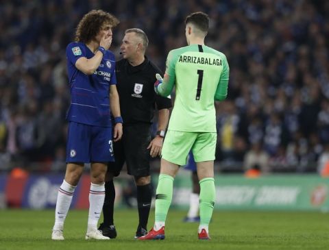 Chelsea's David Luiz, left, talks to Chelsea goalkeeper Kepa Arrizabalaga, right, during the English League Cup final soccer match between Chelsea and Manchester City at Wembley stadium in London, England, Sunday, Feb. 24, 2019. (AP Photo/Alastair Grant)