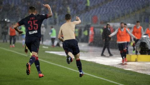 Bologna's Mattia Destro, right, celebrates after scoring his side second goal during an Italian Serie A soccer match between Lazio and Bologna, at the Olympic stadium in Rome, Monday, May 20, 2019. (AP Photo/Andrew Medichini)