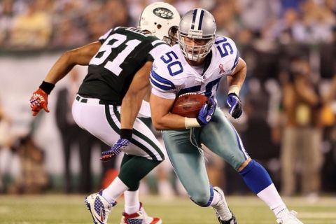 EAST RUTHERFORD, NJ - SEPTEMBER 11:  Sean Lee #50 of the Dallas Cowboys returns an interception of 37-yards in the fourth quarter against the New York Jets during their NFL Season Opening Game at MetLife Stadium on September 11, 2011 in East Rutherford, New Jersey.  (Photo by Elsa/Getty Images)