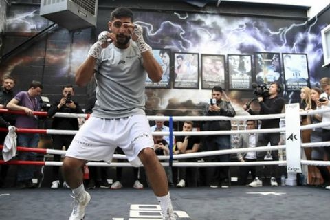 Britain's Amir Khan in action, during a media workout at the Amir Khan Academy, in Bolton, England, Wednesday June 19, 2019. (Peter Byrne/PA via AP)