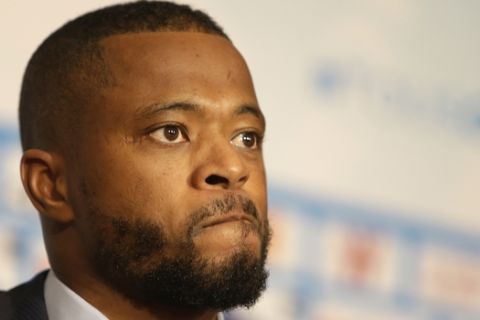 Olympique Marseille new player Patrice Evra, reacts during a his presentation press conference, in Marseille, southern France, Thursday, Jan. 26, 2017. Marseille has signed veteran left back Patrice Evra from Italian champion Juventus, the French club's first significant signing under its new ownership. (AP Photo/Claude Paris)