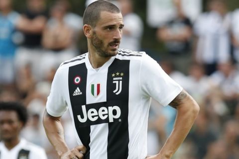 In this Sunday, Aug.12, 2018 file photo Juventus' Leonardo Bonucci participates at a friendly match between the Juventus A and B teams, in Villar Perosa, northern Italy. Bonucci sensationally returned to Juventus from AC Milan as part of the deal which saw Gonzalo Higuain and Mattia Caldara move the other way. (AP Photo/Antonio Calanni)