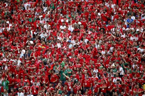 Fans watch the group B match between Portugal and Morocco at the 2018 soccer World Cup in the Luzhniki Stadium in Moscow, Russia, Wednesday, June 20, 2018. (AP Photo/Francisco Seco)