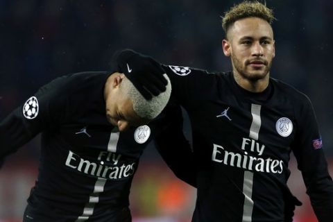 PSG forward Neymar, right, and PSG forward Kylian Mbappe, celebrate after they defeated Red Star during the Champions League group C soccer match, in Belgrade, Serbia, Tuesday, Dec. 11, 2018. (AP Photo/Darko Vojinovic)