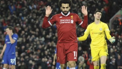 Liverpool's Mohamed Salah celebrates after scoring during the English Premier League soccer match between Liverpool and Chelsea at Anfield, Liverpool, England, Saturday, Nov. 25, 2017. (AP Photo/Rui Vieira)