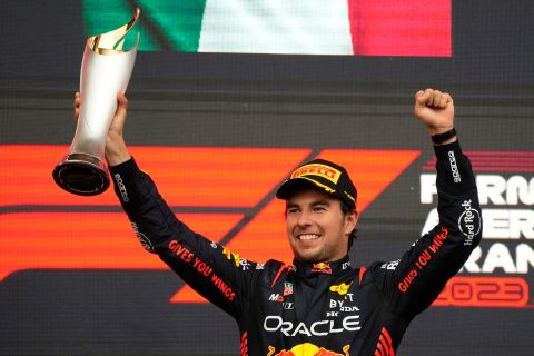 Red Bull driver Sergio Perez of Mexico celebrates on the podium as he won the Formula One Grand Prix at the Baku circuit in Baku, Azerbaijan, Sunday, April 30, 2023. (AP Photo/Sergei Grits)