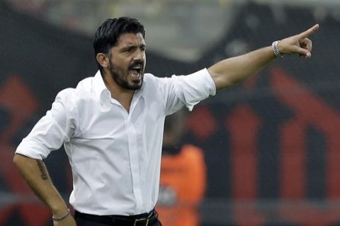 OFI's coach Gennaro Gattuso of Italy gives instructions to his players during a Greek Soccer League match at the Georgios Karaiskakis stadium against Olympiacos in the port of Piraeus, near Athens on Saturday, Sept. 13, 2014. (AP Photo/Thanassis Stavrakis)