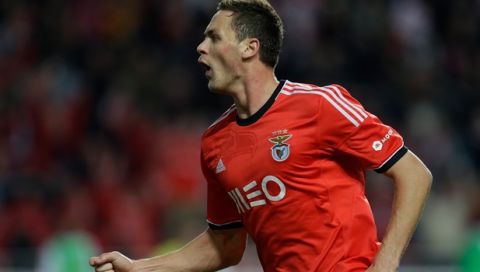 Benfica's Nemanja Matic, from Serbia, celebrates after scoring the opening goal against Braga during their Portuguese league soccer match on Saturday, Nov. 23, 2013, at Benfica's Luz stadium in Lisbon. (AP Photo/Armando Franca)